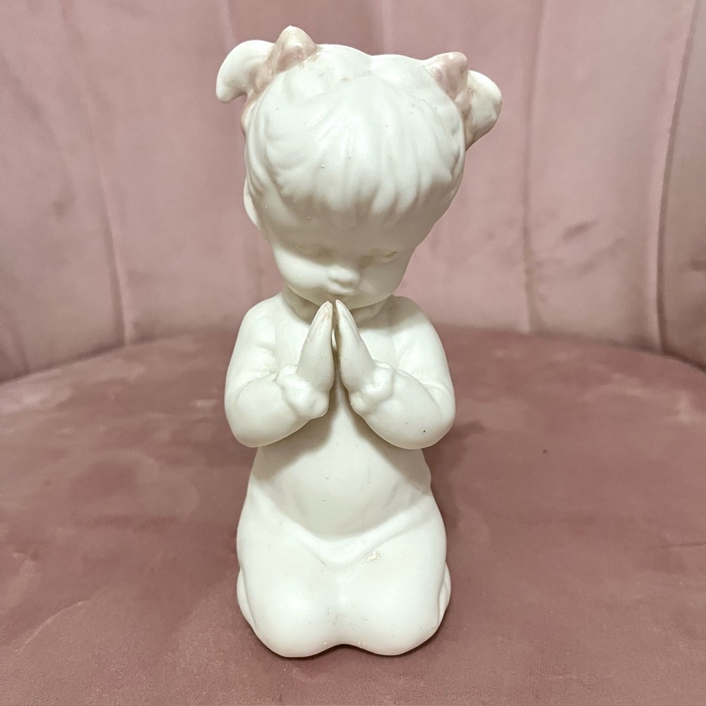 White ceramic praying girl